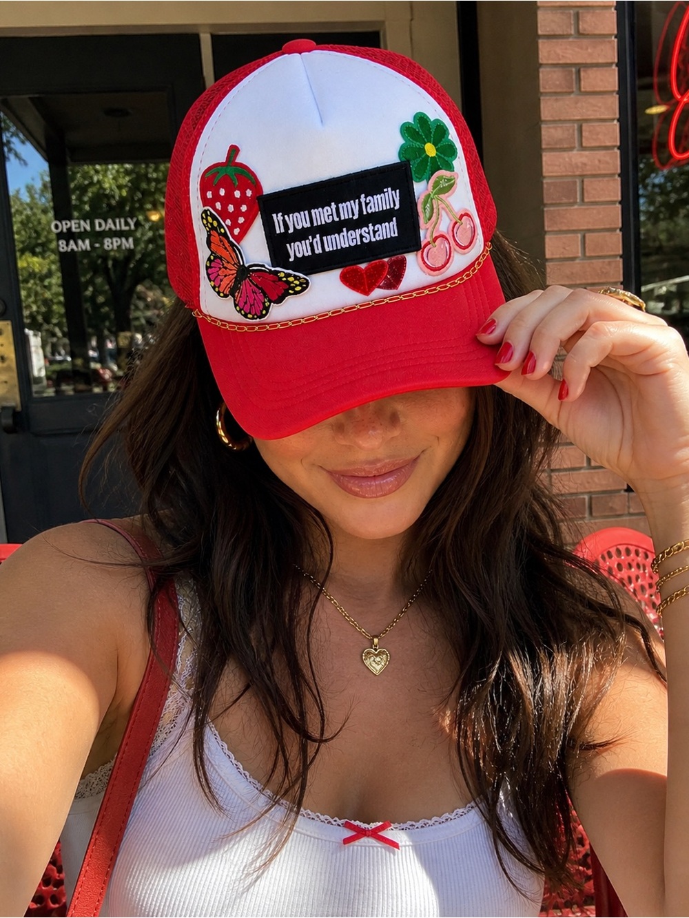 Red and White Embroidered Trucker Hat with Decorative Patches